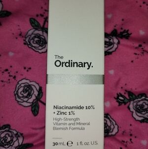 The Ordinary White & Silver Skincare Box on Pink Floral Background